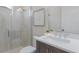 Bathroom features a glass shower and vanity with sink, mirror, and decor at 8364 Sea Glass Ct, Sarasota, FL 34240