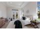 Bright bedroom features comfortable bed with lots of natural light and stylish decor at 8364 Sea Glass Ct, Sarasota, FL 34240
