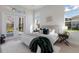 Bright bedroom features comfortable bed with lots of natural light and backyard access at 8364 Sea Glass Ct, Sarasota, FL 34240