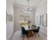 Bright dining room features modern decor and plenty of natural light at 8364 Sea Glass Ct, Sarasota, FL 34240