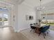 Bright dining room featuring stylish chairs and modern light fixtures at 8364 Sea Glass Ct, Sarasota, FL 34240