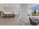 Open-concept kitchen with large island, modern lighting, and stainless steel appliances at 8364 Sea Glass Ct, Sarasota, FL 34240