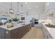 Spacious kitchen with modern appliances, a large center island, and ample storage space at 8364 Sea Glass Ct, Sarasota, FL 34240