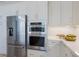 Well-equipped kitchen showcasing stainless steel appliances, ample cabinet space, and sleek countertops at 8364 Sea Glass Ct, Sarasota, FL 34240