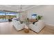 Sun-filled living room showcasing an open floor plan and inviting decor leading to the lanai at 8364 Sea Glass Ct, Sarasota, FL 34240