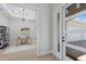 View of the bright office space featuring desk and chair through an open door at 8364 Sea Glass Ct, Sarasota, FL 34240