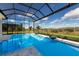 Beautiful in-ground pool inside of screened lanai with views of the backyard at 8364 Sea Glass Ct, Sarasota, FL 34240