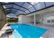 Beautiful pool with screened-in lanai and modern water features, perfect for outdoor living at 8364 Sea Glass Ct, Sarasota, FL 34240