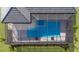 Aerial shot of screened in ground pool with sun-shelf and paver decking at 8364 Sea Glass Ct, Sarasota, FL 34240