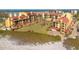 Scenic beachfront condo complex with lush landscaping, offering a serene coastal lifestyle at 8710 Midnight Pass Rd # 501B, Sarasota, FL 34242