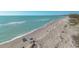Expansive aerial view of the beach, showcasing the stunning shoreline and inviting coastal lifestyle at 8710 Midnight Pass Rd # 501B, Sarasota, FL 34242