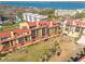 Scenic aerial view of waterfront condos, showcasing the idyllic community and stunning coastal surroundings at 8710 Midnight Pass Rd # 501B, Sarasota, FL 34242