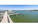 Waterfront view of boat slips with a clear sky above at 8710 Midnight Pass Rd # 501B, Sarasota, FL 34242