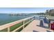 A scenic dock with boat slips and waterfront views create a perfect spot for relaxation at 8710 Midnight Pass Rd # 501B, Sarasota, FL 34242