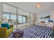 Inviting living room with sliding glass doors that provide access to a balcony with building views at 8710 Midnight Pass Rd # 501B, Sarasota, FL 34242