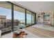 Living room with a sliding door boasting views of the beach, with modern furniture and coastal decor at 8710 Midnight Pass Rd # 501B, Sarasota, FL 34242