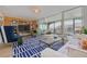 Bright living room with modern decor and a large sliding door offering stunning exterior views at 8710 Midnight Pass Rd # 501B, Sarasota, FL 34242