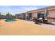 Beautiful backyard with a pool, patio, and screened-in lanai, perfect for outdoor entertaining at 9408 69Th E Ave, Palmetto, FL 34221
