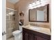 Elegant bathroom with a walk-in shower, granite countertop vanity, and neutral colors at 9408 69Th E Ave, Palmetto, FL 34221