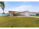 Charming single-story home with well-maintained lawn, attached garage, and inviting curb appeal under a sunny sky at 9408 69Th E Ave, Palmetto, FL 34221