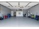 Spacious two-car garage with ample storage shelving and room for tools and equipment at 9408 69Th E Ave, Palmetto, FL 34221