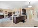 Open-concept kitchen with stainless steel appliances and view into the living area at 9408 69Th E Ave, Palmetto, FL 34221