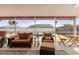 Relaxing screened-in lanai with comfortable seating overlooking the pool and backyard at 9408 69Th E Ave, Palmetto, FL 34221