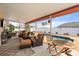 Inviting screened-in lanai with comfortable seating, dining table, and pool view at 9408 69Th E Ave, Palmetto, FL 34221