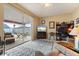 Comfortable living room with access to a screened-in patio and a built in workstation at 9408 69Th E Ave, Palmetto, FL 34221