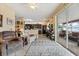 Open-concept living area with kitchen view and access to the screened-in patio at 9408 69Th E Ave, Palmetto, FL 34221