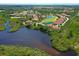 Stunning aerial view of a golf course community with waterfront homes and lush landscaping at 9460 Discovery Ter # 202D, Bradenton, FL 34212