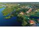 Aerial view showcasing golf course homes, lush landscaping, and winding waterways at 9460 Discovery Ter # 202D, Bradenton, FL 34212