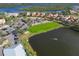 Panoramic aerial view showcasing the community's waterfront location, golf course, parking, and residences at 9460 Discovery Ter # 202D, Bradenton, FL 34212