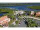 Stunning aerial view of a waterfront community featuring a marina, clubhouse, and residential properties at 9460 Discovery Ter # 202D, Bradenton, FL 34212