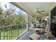 Relaxing outdoor balcony space with ceiling fan and comfortable seating at 9460 Discovery Ter # 202D, Bradenton, FL 34212