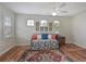 Bright bedroom features a daybed, three windows and stylish decor at 9460 Discovery Ter # 202D, Bradenton, FL 34212