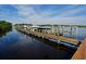 Well-maintained boat docks offer convenient access to the water, surrounded by lush greenery and clear skies at 9460 Discovery Ter # 202D, Bradenton, FL 34212