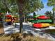 Outdoor storage rack with colorful kayaks, ideal for waterfront community living at 9460 Discovery Ter # 202D, Bradenton, FL 34212