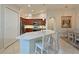 Open kitchen design with island, granite countertops, and stainless steel appliances at 9460 Discovery Ter # 202D, Bradenton, FL 34212
