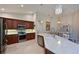 Open kitchen design with island, granite countertops, and stainless steel appliances at 9460 Discovery Ter # 202D, Bradenton, FL 34212