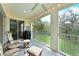 Screened patio with outdoor seating and views of lush greenery at 9460 Discovery Ter # 202D, Bradenton, FL 34212