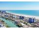 An aerial view of the condo buildings and a beautiful canal leading to the ocean at 101 Benjamin Franklin Dr # 63, Sarasota, FL 34236