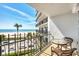 Relaxing balcony view overlooking the beach, ocean, and street from this condo unit at 101 Benjamin Franklin Dr # 63, Sarasota, FL 34236