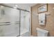Clean and functional bathroom with a shower, tub, and essential fixtures at 101 Benjamin Franklin Dr # 63, Sarasota, FL 34236