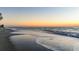 Beautiful view of the beach with tranquil water lapping on the beach at 101 Benjamin Franklin Dr # 63, Sarasota, FL 34236