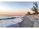 Scenic beach view with tranquil water and picturesque sandy shore at sunset at 101 Benjamin Franklin Dr # 63, Sarasota, FL 34236