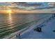 Breathtaking sunset view over the ocean with sandy beach and dramatic cloudy sky at 101 Benjamin Franklin Dr # 63, Sarasota, FL 34236