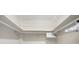 Bright closet offering white walls, an upper metal wire rack and a hanging rod for optimal storage solutions at 101 Benjamin Franklin Dr # 63, Sarasota, FL 34236