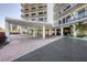 The condo's entrance is covered, leading to the front doors, with landscaping around the property at 101 Benjamin Franklin Dr # 63, Sarasota, FL 34236