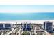Exterior shot of a beachfront property with views of the ocean and sandy white beach at 101 Benjamin Franklin Dr # 63, Sarasota, FL 34236